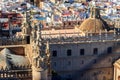 View from the Giralda Tower out over the roof and spires of Seville cathedral with the city in view in Seville, Spain Royalty Free Stock Photo