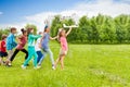 View of girl holding airplane toy and kids behind Royalty Free Stock Photo