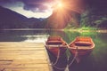 View of glacial mountain Lake Biogradsko, wooden pier and boats in forest. Biogradska Gora National Park. Montenegro.