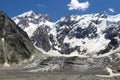 View of the glacier Mizhirgi. The Northern wall of the Mijirghi massif. Caucasus mountains Royalty Free Stock Photo