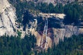 The view from Glacier Point in Yosemite National Park. Half Dome, Vernal Falls lower and Navada Falls upper Royalty Free Stock Photo