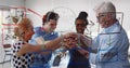 View through glass board of diverse team putting hands together celebrating success Royalty Free Stock Photo