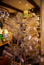 View on glass bottles on rack in French shop selling typical products from Provence