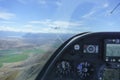View from with glider glider cockpit while under tow from tow-plane