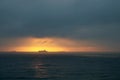 SUNRISE ON THE INDIAN OCEAN WITH A SHIP ON THE HORIZON