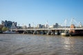 A view of Golden Jubilee and Hungerford bridges from South Bank of Thames River in London