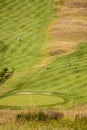 view of the golf course and beach of Zarautz with mount San Anton of Guetaria on the background on a bright summer day. Royalty Free Stock Photo