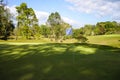 View of Golf Course with beautiful putting green. Golf course with a rich green turf beautiful scenery Royalty Free Stock Photo