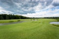 View on golf course at cold day with rainy clouds Royalty Free Stock Photo