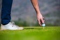 View of a golfer teeing off from a golf tee Royalty Free Stock Photo