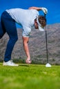 View of a golfer teeing off from a golf tee Royalty Free Stock Photo