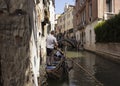 View of a gondola driver, little bridge, canal