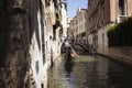 View of a gondola driver, little bridge, canal