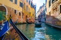 A view from gondola during the ride through the canals of Venice