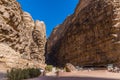 A view into a gorge in the desert landscape in Wadi Rum, Jordan Royalty Free Stock Photo
