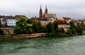 View of the Gothic red brick Basel Cathedral and the embankment of the Rhein River in the city of Basel, Switzerland Royalty Free Stock Photo
