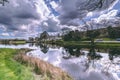 View of the Gouganebarra Lake and the river Lee, with the Gougane Barra Hotel in the background. Royalty Free Stock Photo