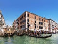 View on the Grand canal and gondolas with tourists, Venice