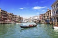 View of the Grand Canal, the Rialto Bridge and the gondola with tourists. Venice