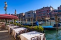 View of the Grand Canal, Rialto Bridge, and gondolas from outdoor restaurant seats, Venice