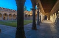 View of the grassed cloister of the University of Salamanca from the corridors with the shadows and silhouettes by the evening