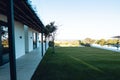 View of grassy land in yard in front of nursing home against clear sky, copy space Royalty Free Stock Photo