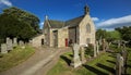 A view of the graveyard and church building in Aberlemno in Angus, Scotland Royalty Free Stock Photo
