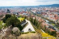 View at Graz City from Schlossberg hill, City rooftops, Mur river and city center, clock tower.