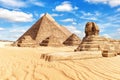 View on the Great Sphinx and the Pyramids in Giza Royalty Free Stock Photo