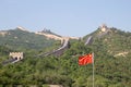 View of the Great Wall of China and the Chinese flag. Royalty Free Stock Photo