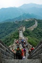 A view of Great Wall of China, Mutianyu part with tourists climbing the steep stairs Royalty Free Stock Photo