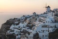 View on Greek village with white wind mill during sunset, Oia, Santorini, Greece Royalty Free Stock Photo