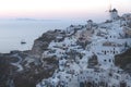 View on Greek village with wind mill after sunset, Oia, Santorini, Greece Royalty Free Stock Photo