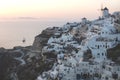 View on Greek village with wind mill and terraces during sunset, Oia, Santorini, Greece Royalty Free Stock Photo