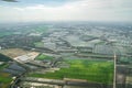 The view of green field and farm and city downtown in middle of Thailand. It shot from Jetplane