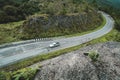 View of green hills and trees. Views of mountains and buildings The view of the road cuts through the natural route. animal