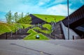 View of green lawns and black stairs near International Congress Hall in Katowice