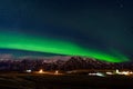 View of green Northern lights above peaceful countryside, Iceland Royalty Free Stock Photo