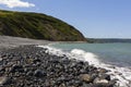 View of Greencliff Beach at High Tide, Looking South West towards Bucks Mills, Devon, UK.