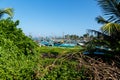 View through the greenery as a frame on fishing boats on ocean shore of Galle, Sri Lanka Royalty Free Stock Photo