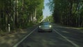 View of grey sport car strating form bus stop