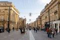 A view of Grey Street in the city of Newcastle upon Tyne, UK, by Monument, with people