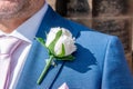 View of a groom wearing an artificial rose buttonhole Royalty Free Stock Photo