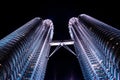 View from the ground on the beatiful light show at one of Petronas Twin Towers at night. World famous iconic landmark Royalty Free Stock Photo