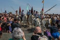 A group of gardians and camargue horses in the sea Royalty Free Stock Photo