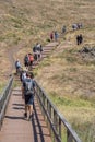 View of a group of tourists hiking in St. LourenÃ§o Cape or Cabo de SÃ£o LourenÃ§o