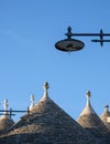 View of group of traditional dry stone trullo houses in Alberobello, Puglia Italy.