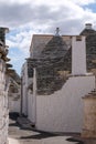 View of group of traditional trulli houses in the Aia Piccola residential area of Alberobello in the Itria Valley, Puglia Italy