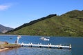 View of Groves Arm Jetty by Queen Charlotte Drive scenic tourist route road, at Okiwa Bay, Queen Charlotte Sound, South Island New Royalty Free Stock Photo