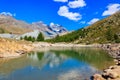 View of Grunsee lake (Green Lake) and the Swiss Alps at summer on Five Lakes Trail in Zermatt, Switzerland